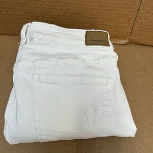 American Eagle Ne(x)t Level Stretch Hi-Rise Jegging White Distressed Raw Hem‎ 14